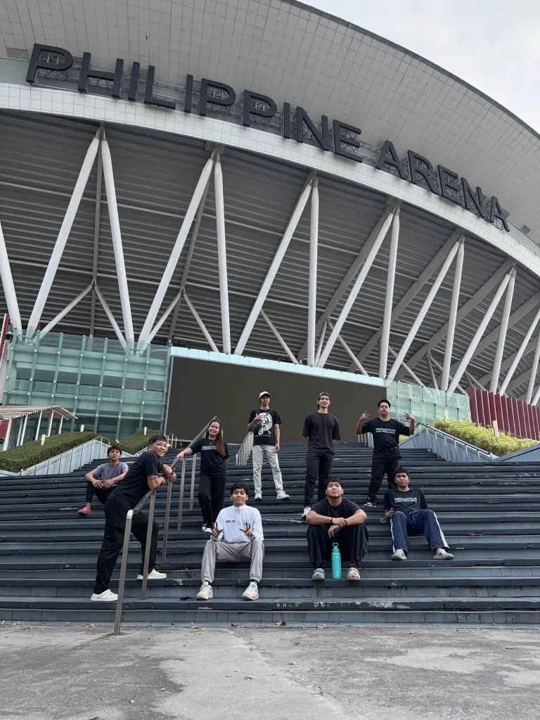 Events Rental Hub team posing on the steps in front of the Philippine Arena